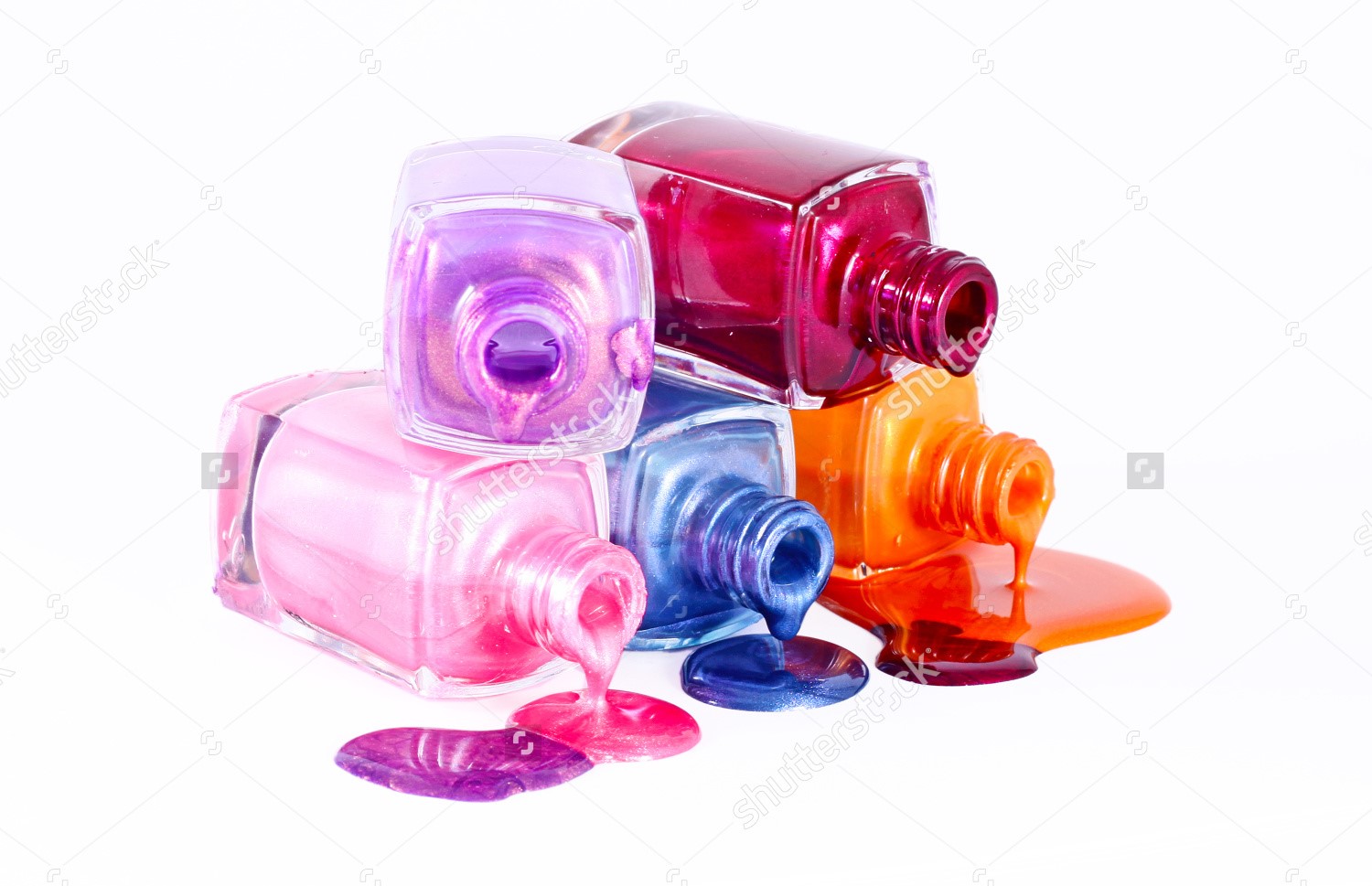 stock-photo-bottles-with-spilled-nail-polish-over-white-background-101338831